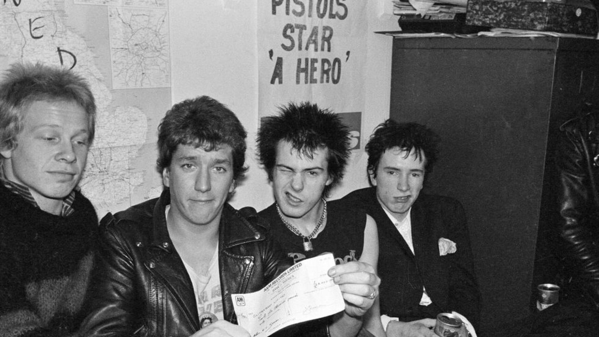 SEX PISTOLS  ESTRENA MONEDA CONMEMORATIVA DE LA REINA ISABEL II